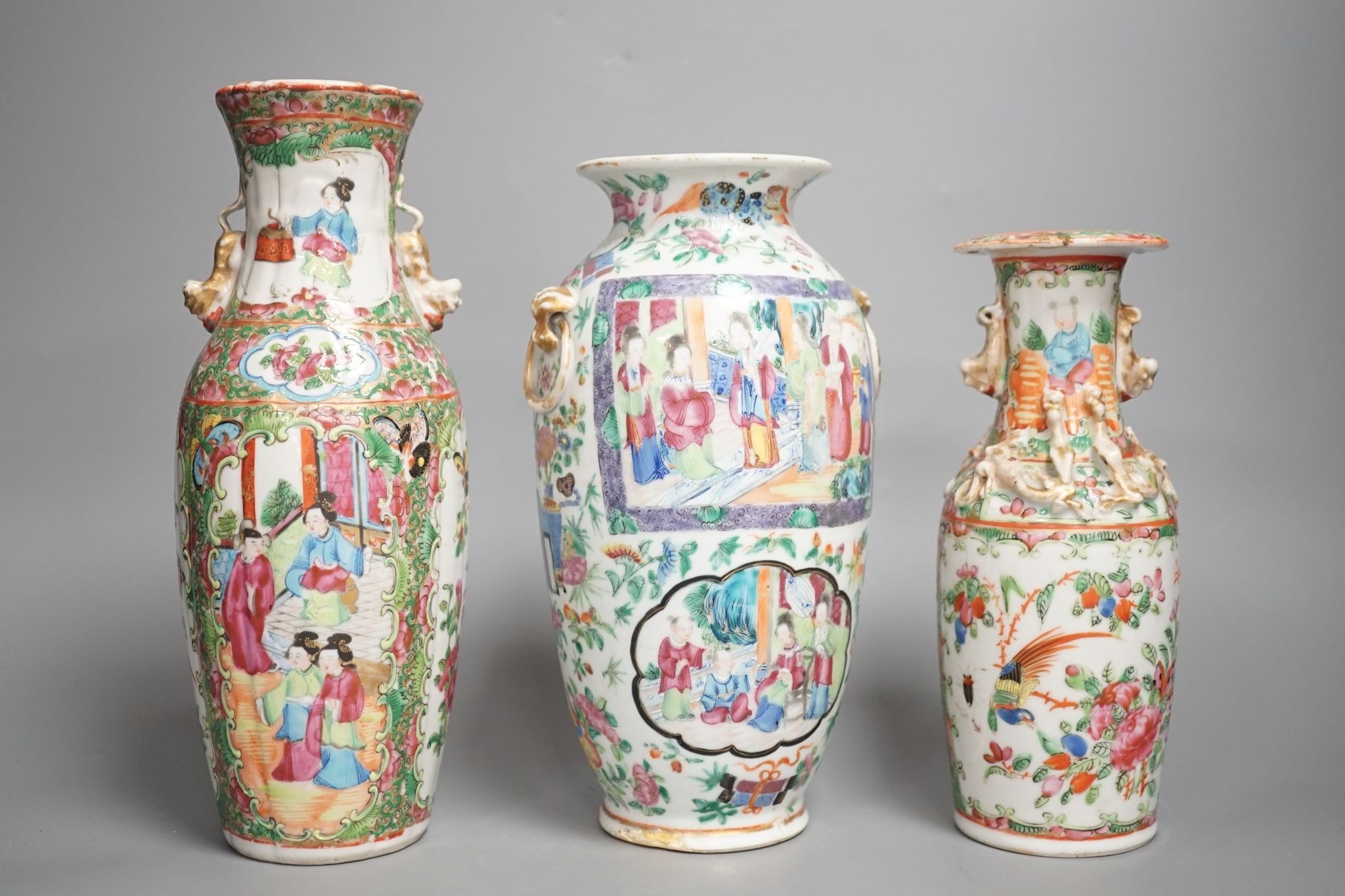 Three 19th century Chinese famille rose vases, Tallest 25 cms high.